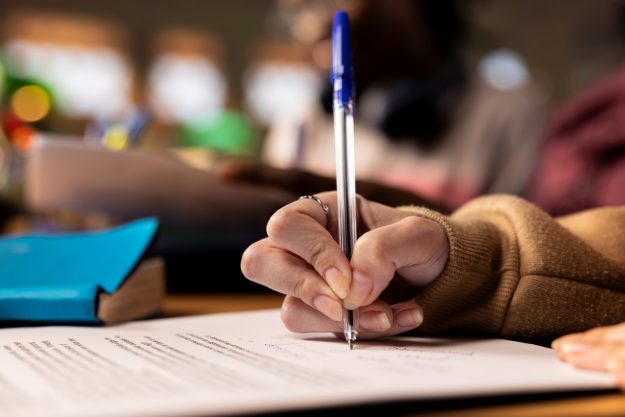 Team of college students working on a project related to business management